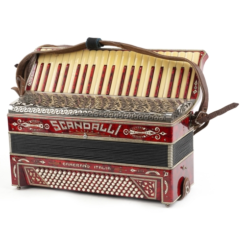 1436 - Scandalli, an Italian red marbleised piano accordion with protective case, 50cm wide.