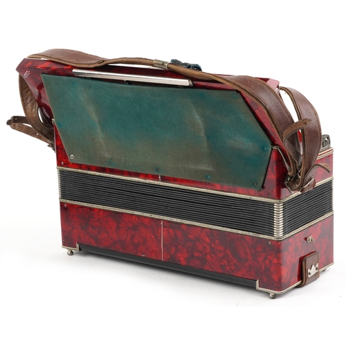 1436 - Scandalli, an Italian red marbleised piano accordion with protective case, 50cm wide.