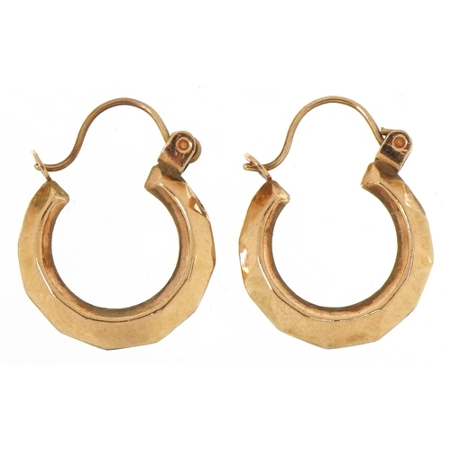 A pair of unmarked gold hoop earrings, 1.3cm in diameter, total 0.7g.