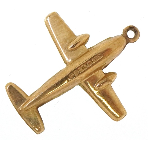 A 9ct gold charm in the form of an aeroplane, 1.8cm high, 0.7g.