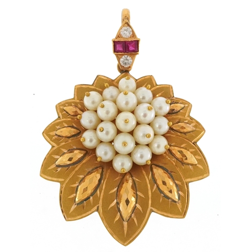 An unmarked gold simulated pearl leaf design pendant set with rubies and white sapphires, tests as 15ct gold, 5.5cm high, 17.0g.
