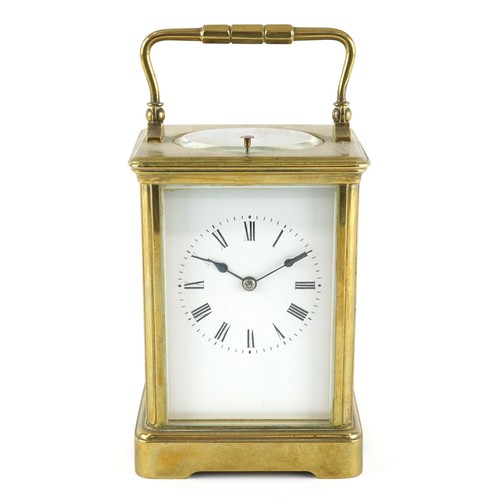 21 - An early 20th century gilt brass repeater carriage clock, the white enamelled dial with black Roman ... 