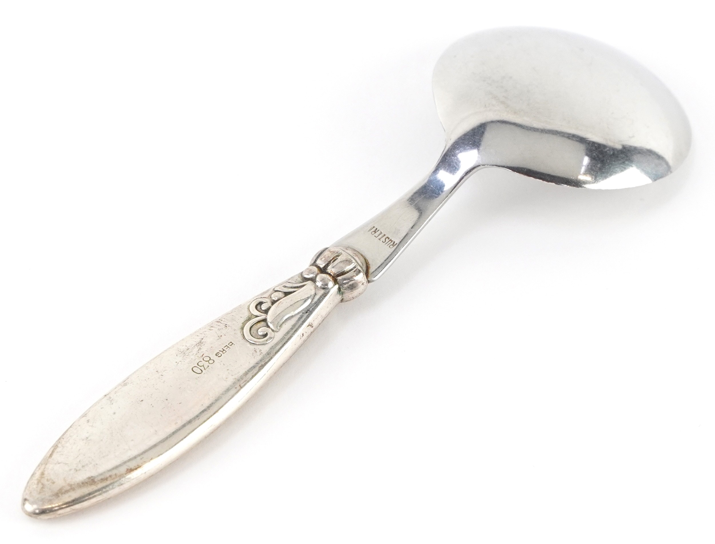 A Scandinavian 830 grade silver and stainless steel spoon embossed with ...