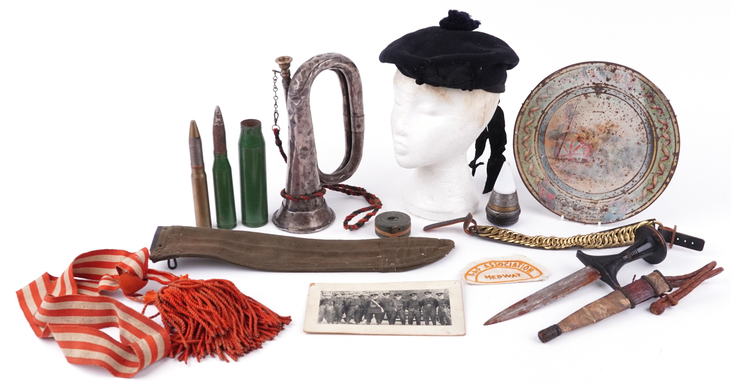 A collection of military interest items including a Henry Potter bugle ...