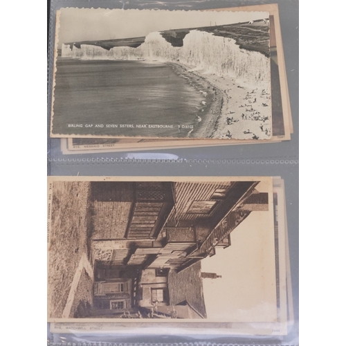 A collection of early 20th century and later postcards, some black and ...
