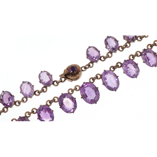 An early 20th century gilt metal graduated amethyst necklace, the ...