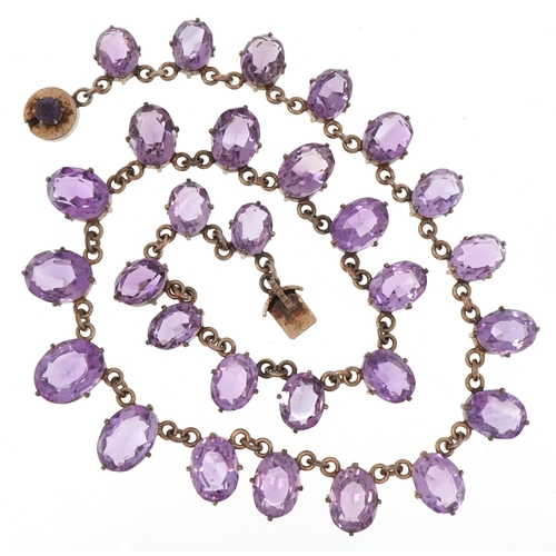 An early 20th century gilt metal graduated amethyst necklace, the ...
