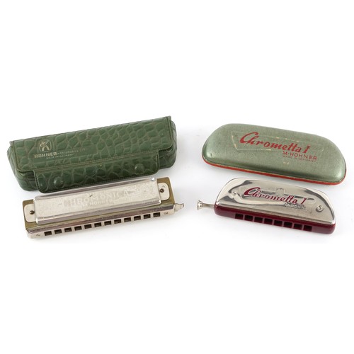Two vintage Hohner harmonicas, each cased, the largest 14cm wide.