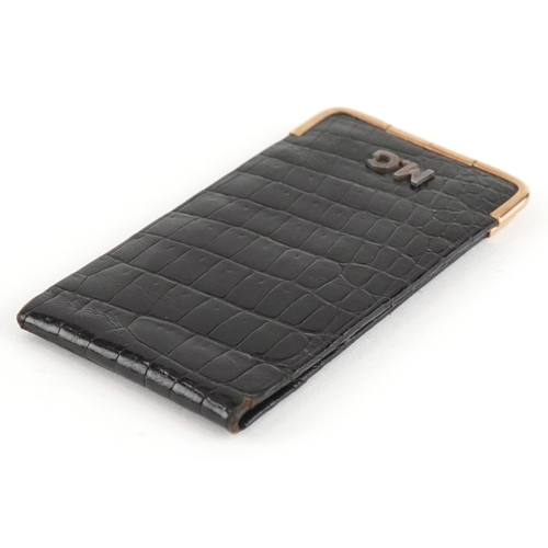 116 - A Cartier 9ct gold mounted crocodile leather etui monogrammed MG, 13cm wide open.
