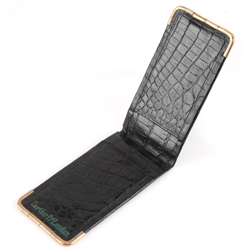 116 - A Cartier 9ct gold mounted crocodile leather etui monogrammed MG, 13cm wide open.