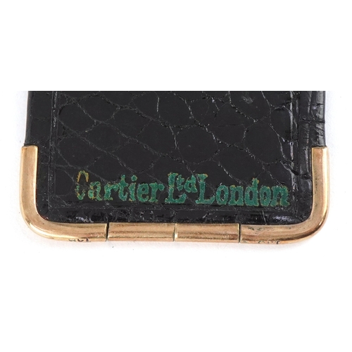 116 - A Cartier 9ct gold mounted crocodile leather etui monogrammed MG, 13cm wide open.