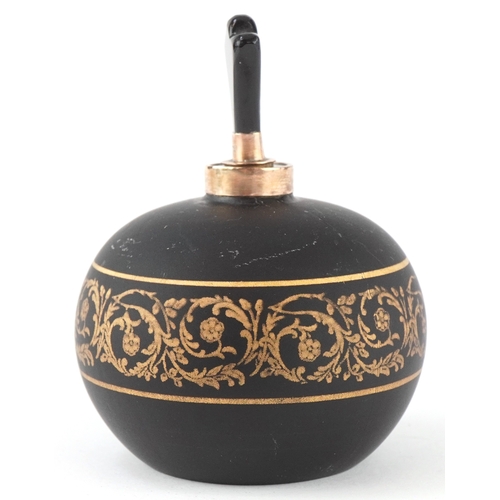 166 - A 9ct gold mounted black glass perfume bottle with gilded scrolling decoration, 7cm high.
