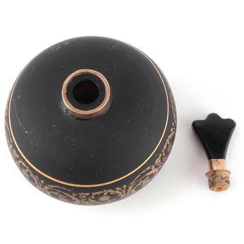 166 - A 9ct gold mounted black glass perfume bottle with gilded scrolling decoration, 7cm high.