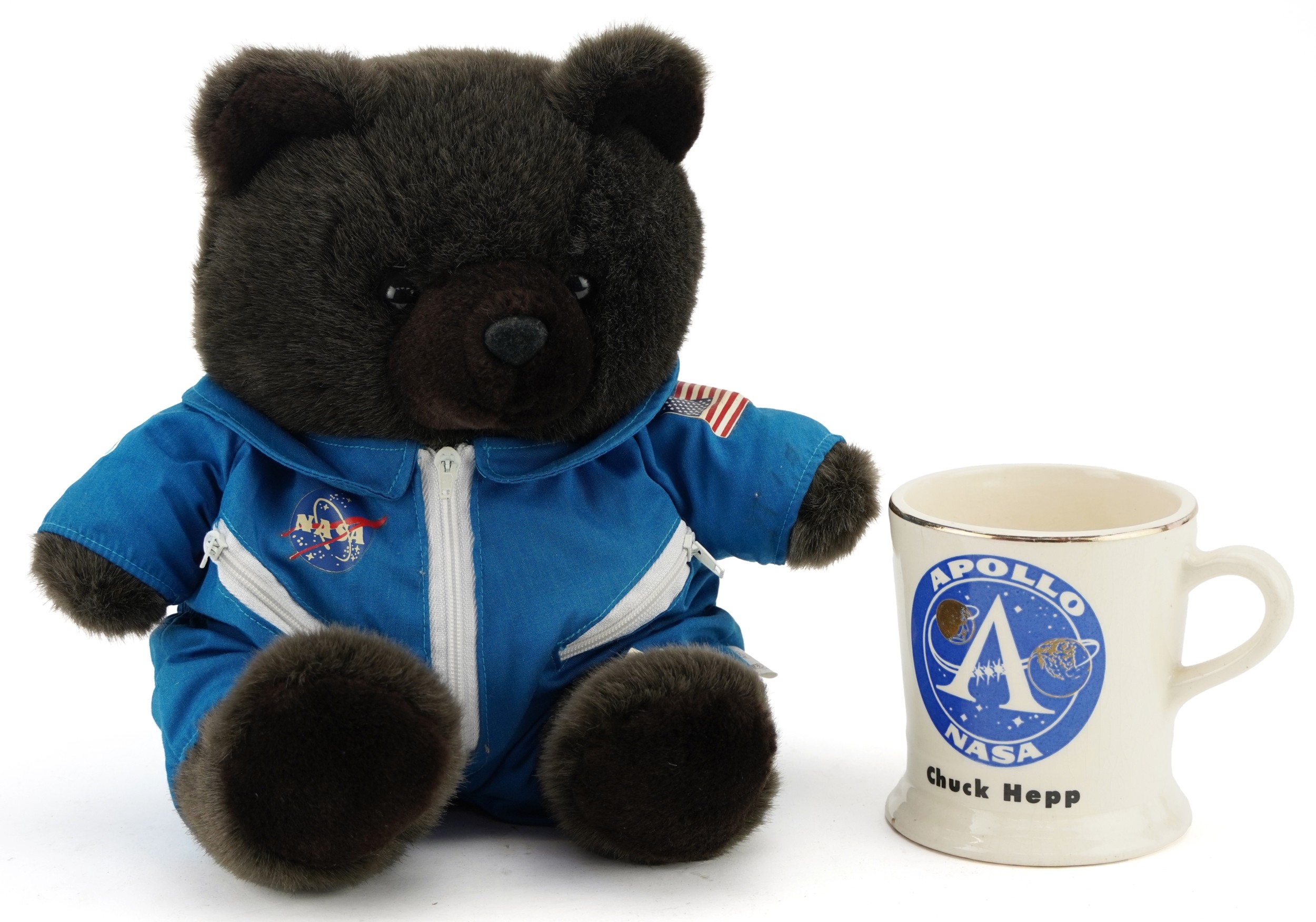 A NASA teddy bear wearing an astronaut suit together with a NASA Apollo ...