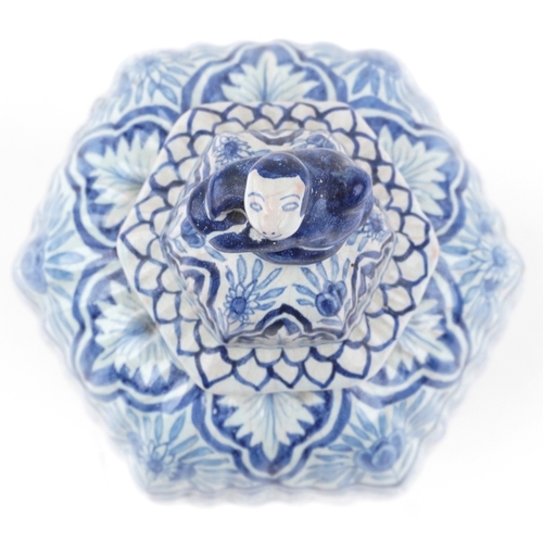 198 - A Chinese porcelain hexagonal vase and cover with animalia knop, hand painted with floral decoration... 