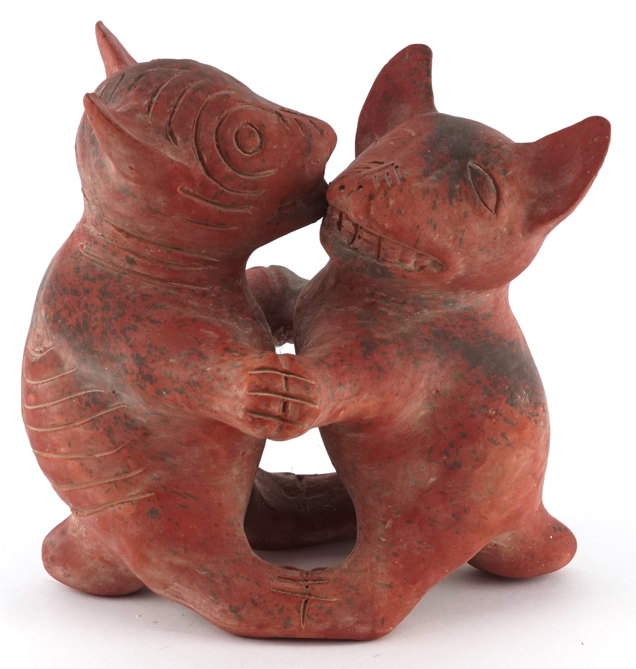 A terracotta figure group of Colima dogs, 20cm high.