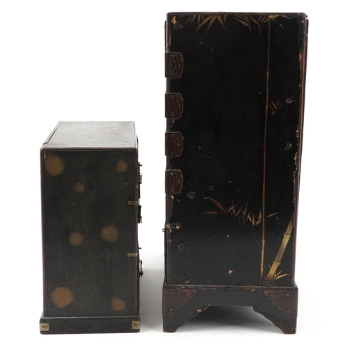 1414 - Two Japanese black lacquered table top chests hand painted and gilded with birds amongst flowers, ea... 