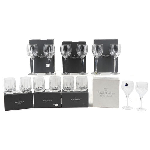 607 - A collection of Waterford Crystal glasses comprising flutes, tumblers and goblets, unused and boxed,... 