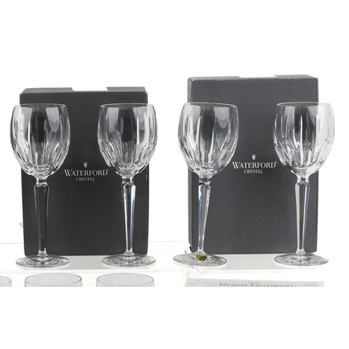 607 - A collection of Waterford Crystal glasses comprising flutes, tumblers and goblets, unused and boxed,... 