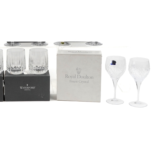 607 - A collection of Waterford Crystal glasses comprising flutes, tumblers and goblets, unused and boxed,... 