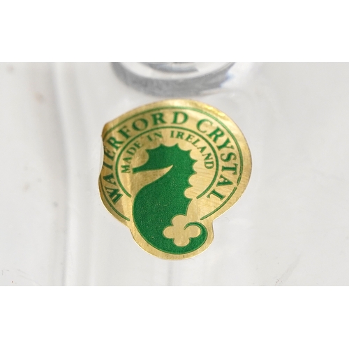 607 - A collection of Waterford Crystal glasses comprising flutes, tumblers and goblets, unused and boxed,... 