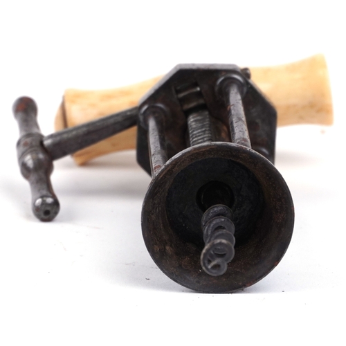 118 - An antique steel rack and pinion corkscrew 'Kings Corkscrew' with bone handle, 17cm in length.