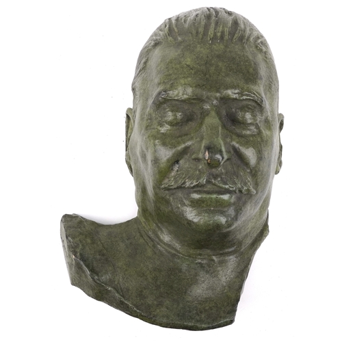 2683 - A patinated bronze death mask of Josef Stalin, 34cm high.