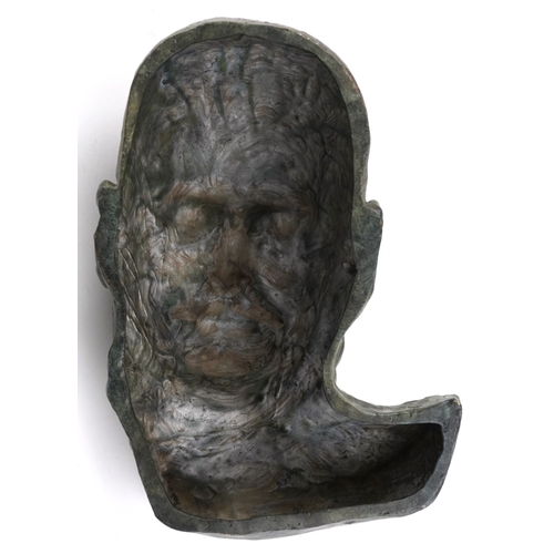 2683 - A patinated bronze death mask of Josef Stalin, 34cm high.
