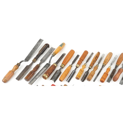 A collection of vintage wooden handled woodworking chisels including D ...