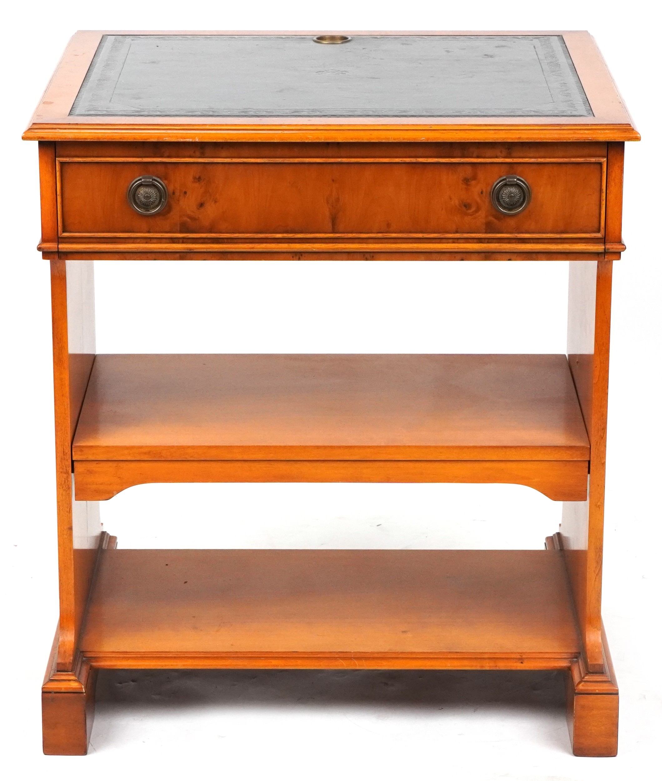 A later 20th century yew wood writing table fitted with a drawer, on ...