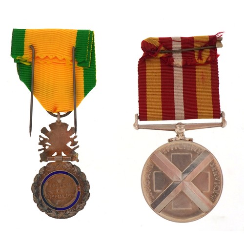 2647 - A military interest Red Cross Voluntary Service medal awarded to Miss Winifred. A. Low together with... 