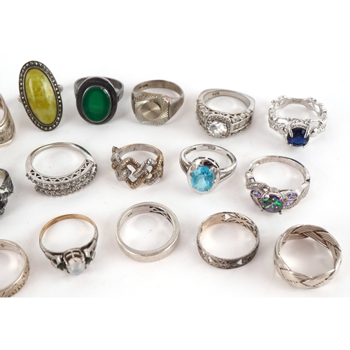 Twenty two vintage and later silver and white metal rings, some set ...