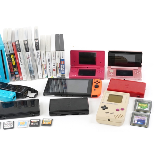 Vintage and later handheld games consoles with games and accessories ...