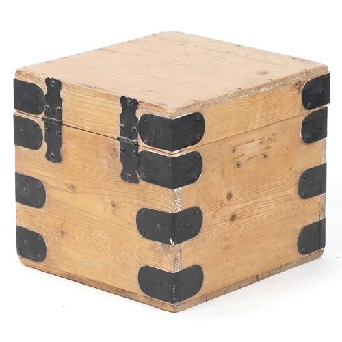 A 20th century pine and metal bound box, 29cm H x 31cm W x 32cm D.