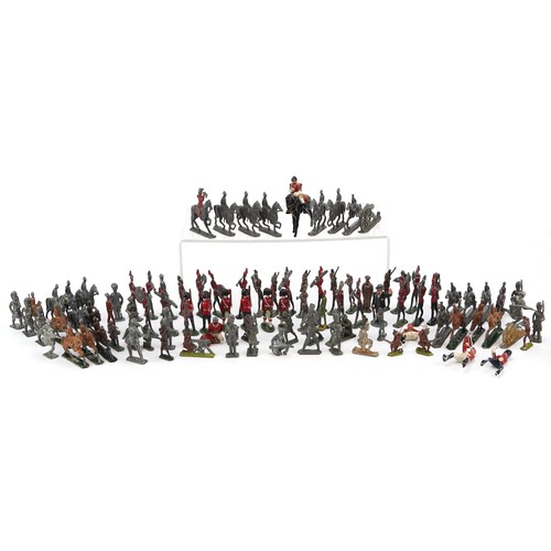 A collection of vintage lead model soldiers and soldiers on horseback ...