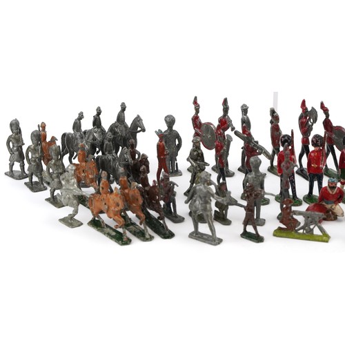 A collection of vintage lead model soldiers and soldiers on horseback ...