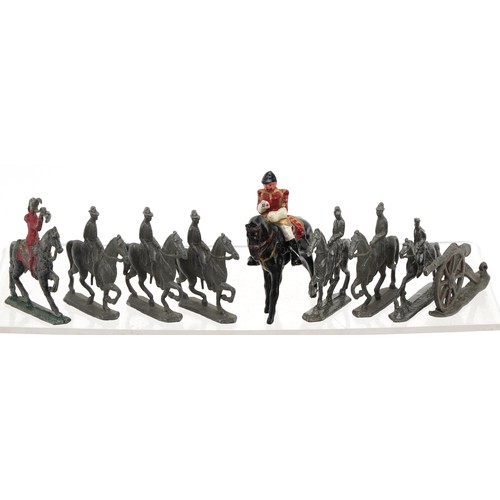A collection of vintage lead model soldiers and soldiers on horseback ...