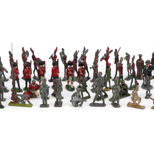 A collection of vintage lead model soldiers and soldiers on horseback ...