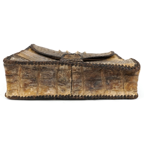1017 - A taxidermy interest hornback crocodile leather bag with two compartments, 26cm high x 26cm wide.