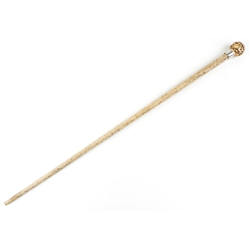 418 - A Victorian whalebone walking stick with silver collar, Birmingham 1894, the handle carved with frog... 