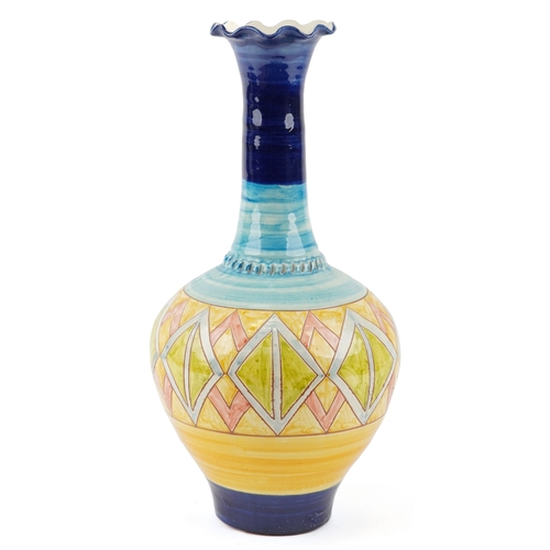 445 - A large 20th century terracotta bottleneck vase with hand painted geometric decoration, 52cm high.