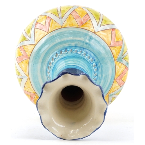 445 - A large 20th century terracotta bottleneck vase with hand painted geometric decoration, 52cm high.