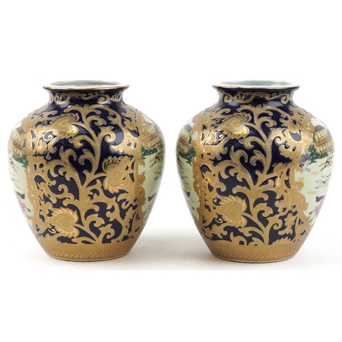 1444 - A pair of Chinese vases decorated with hunting scenes, character marks to the bases, 21cm high.