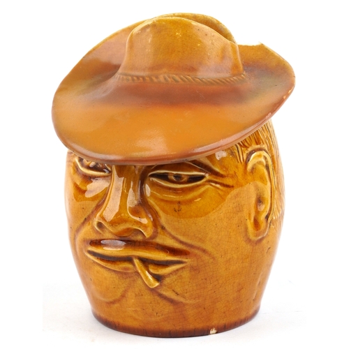 329 - An early 20th century Salopian tobacco jar and cover in the form of a gentleman smoking, modelled by... 