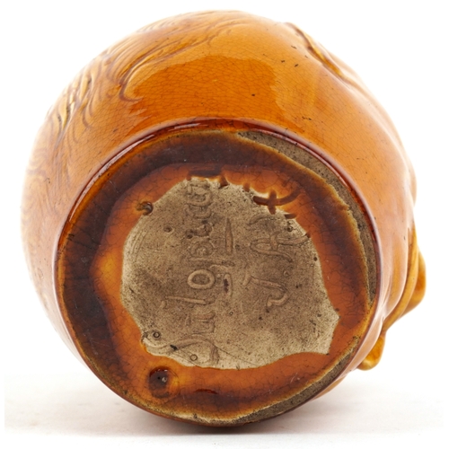 329 - An early 20th century Salopian tobacco jar and cover in the form of a gentleman smoking, modelled by... 