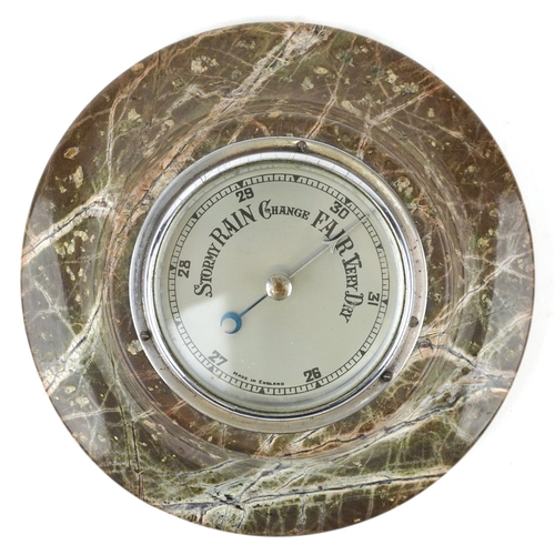 312 - A marble barometer with silvered dial, 17.5cm in diameter.