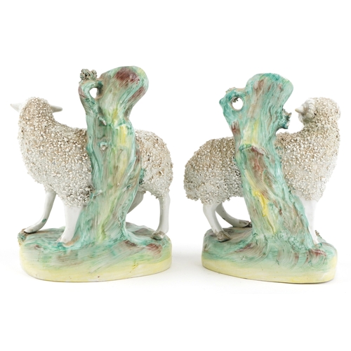  Two Victorian Staffordshire ram spill vases, 18cm high.
