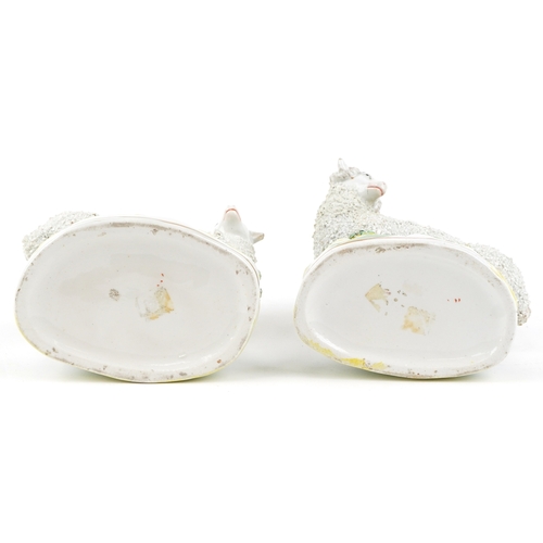  Two Victorian Staffordshire ram spill vases, 18cm high.