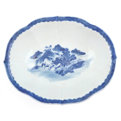 1450 - A Chinese blue and white porcelain footed dish hand painted with figures in a rural landscape, 8.5cm... 