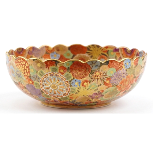  A Japanese Satsuma earthenware bowl with intricate hand painted gilded floral pattern having a scall... 